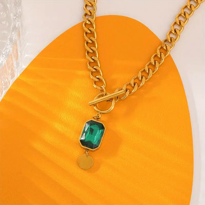 Dikke ketting met smaragdgouden hanger