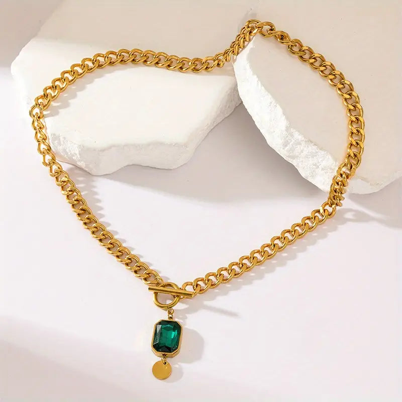 Dikke ketting met smaragdgouden hanger