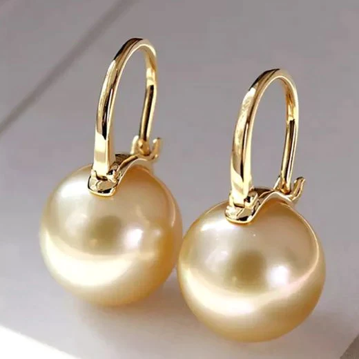 Elegante gouden parel oorbellen