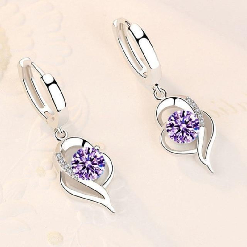 Oorbellen van sterling zilver met ingelegde zirkonia bloemen | Witgoud