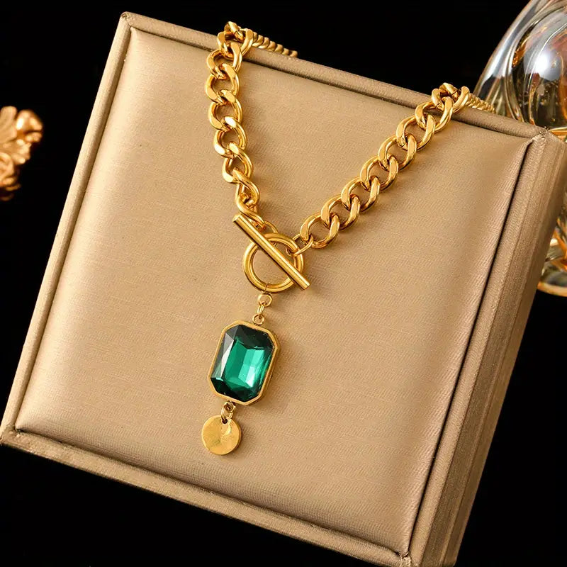 Dikke ketting met smaragdgouden hanger
