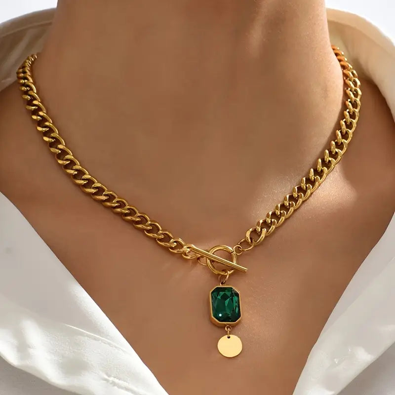 Dikke ketting met smaragdgouden hanger
