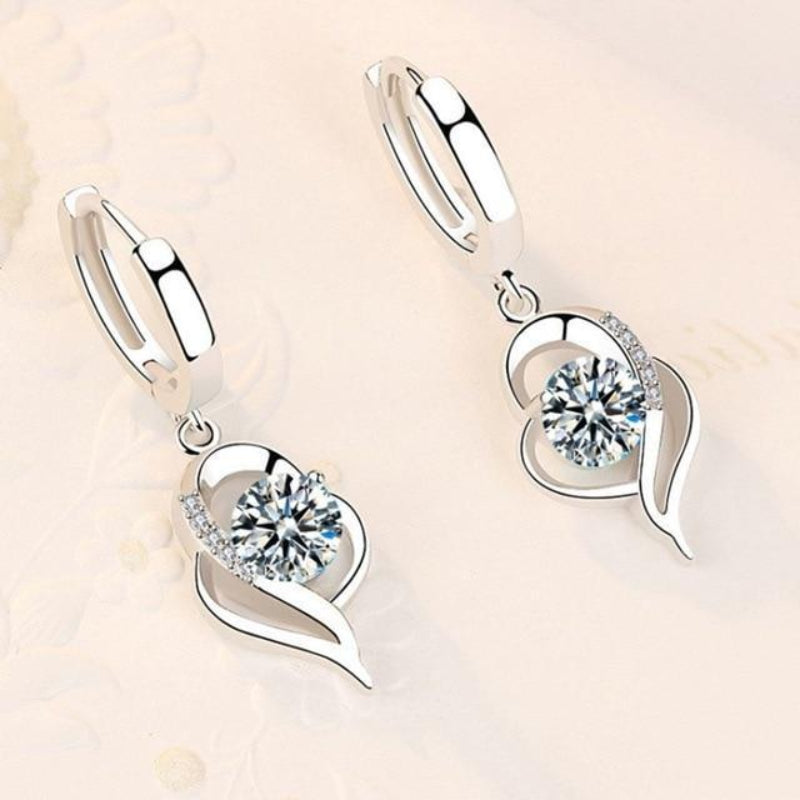 Oorbellen van sterling zilver met ingelegde zirkonia bloemen | Witgoud