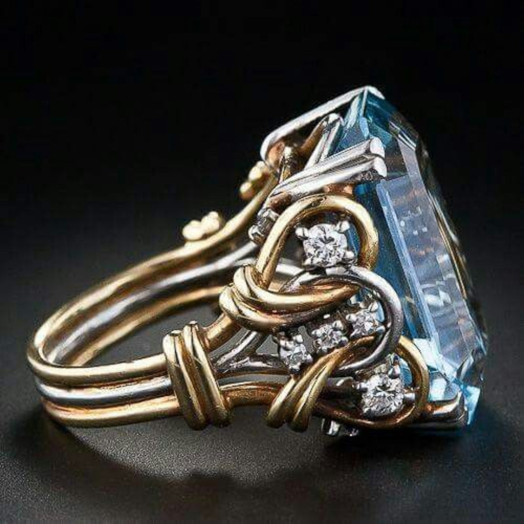 Vintage ring van goud met blauwe zirkonia en meerdere lagen