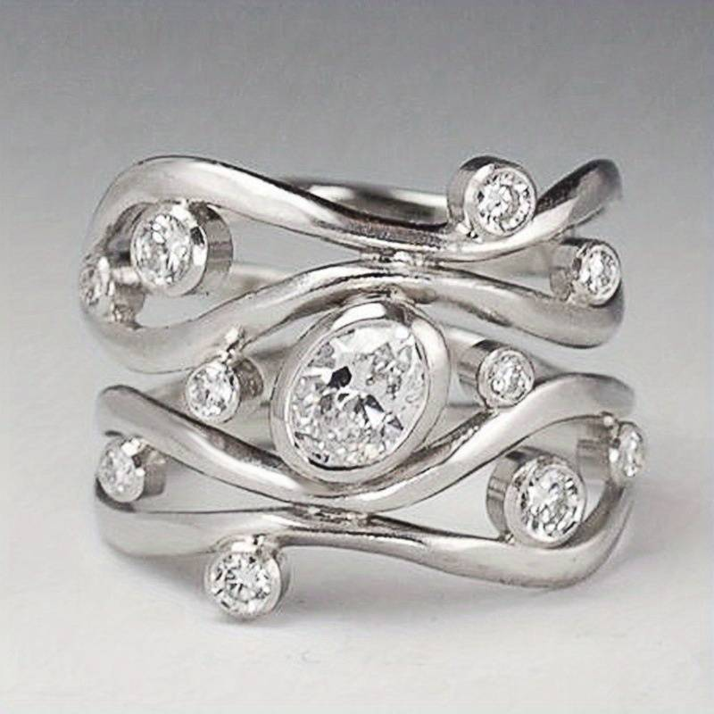 Vintage zilveren ring met zirkonia in onregelmatige vorm.